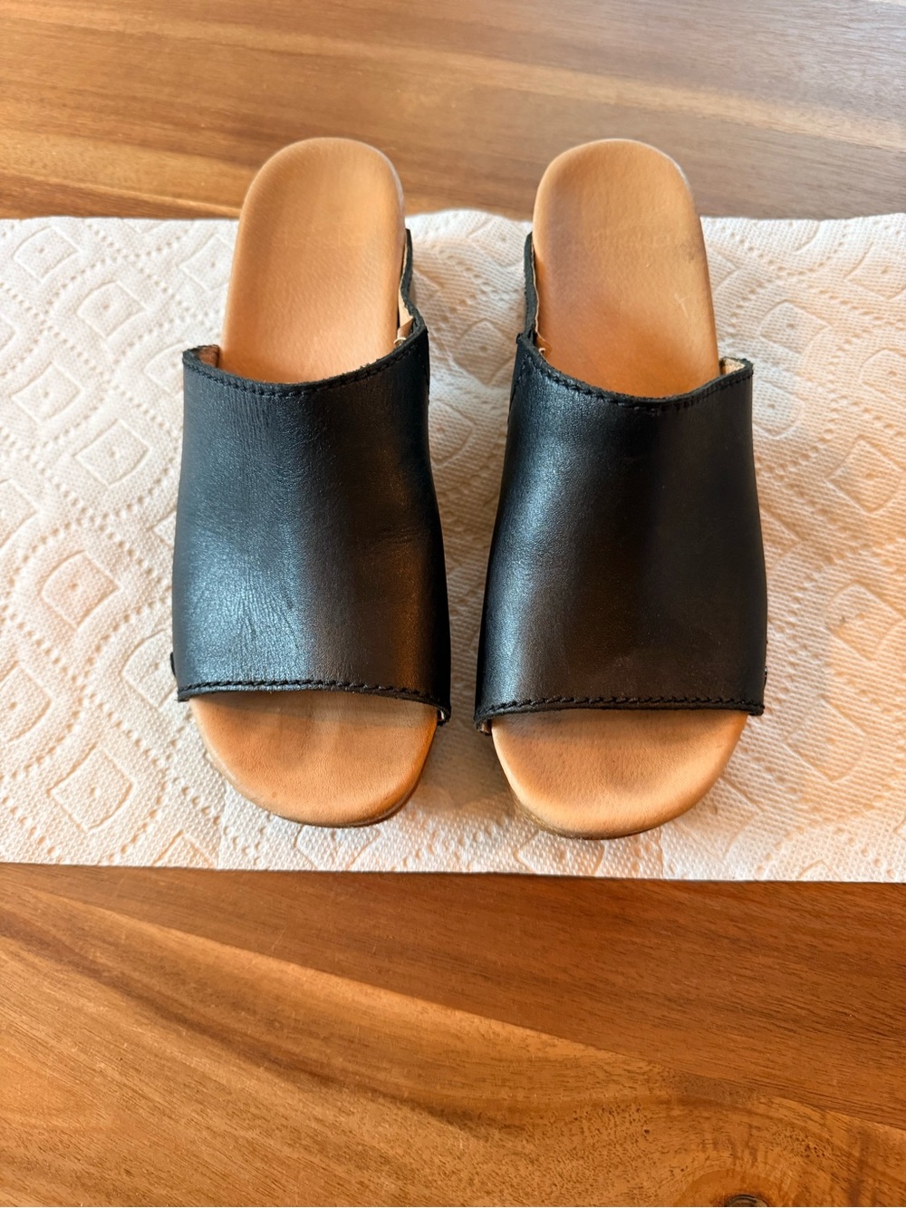 Dansko Black Slip-On Mules with Tan Footbed